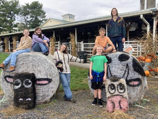 Youth posing on hay bales